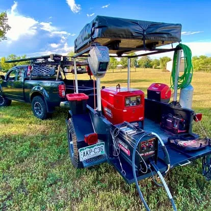 Trailer equipped with welding machines, gas, cables, and tools