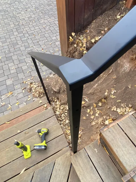 Finished black steel railing corner viewed from above