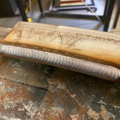 Close view of a uniform finished weld bead